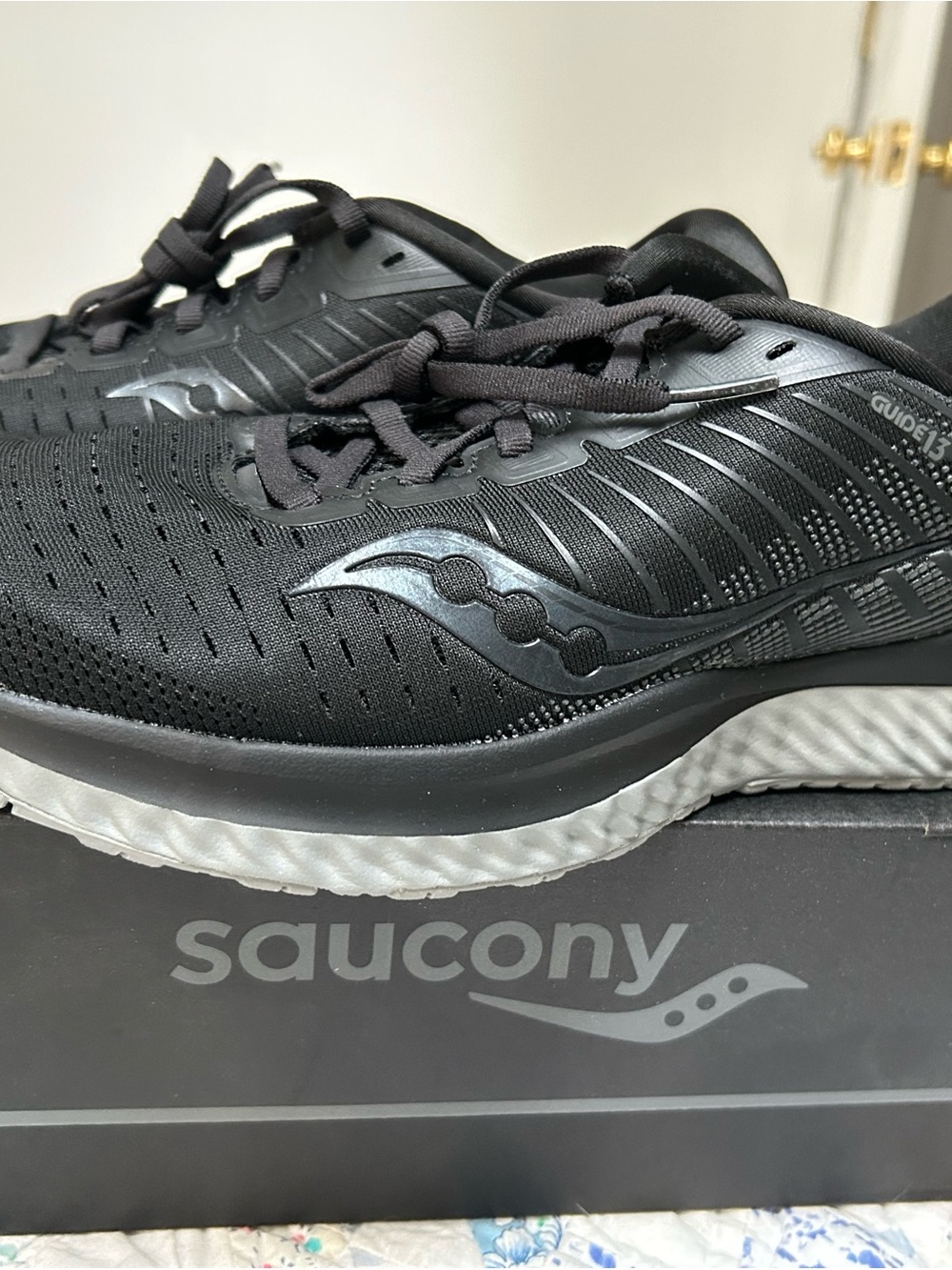 Saucony women’s Black Athletic Running Shoes with White Midsole